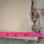 Expressions NYC Vegan Leather w/ Suede Fringe Crossbody Bag in Cream. Photo 4