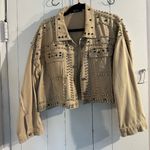 Akira  Tan Jean Fabric with Silver and Black Accent Studs embellished all over. Photo 0