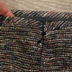 Tahari  pencil skirt.  Size: 12.  Small slit on back. Metallic thread throughout. Photo 3