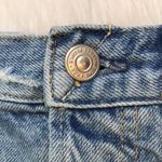 We The Free  Women’s Distressed Raw Hem Light Wash Button-Up Denim Shorts Photo 3