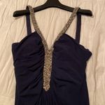 The brand is JS Boutique, it’s a size 10, and it’s color is navy blue. Photo 1