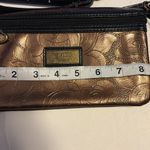 GiGi HILL BRONZE COLORED CROSSBODY OR WRISTLET
HAS BOTH STRAPS
VEGAN LEATHER Brown Photo 5