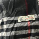 Black and White Plaid Scarf with Red Accents Photo 1