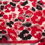 Bebe Red Pink Black and White Floral Capri. Size Medium. EUC Photo 4