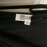 The Comfy Black long sleeve open back romper Photo 2