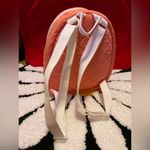 Adidas This stylish orange mini backpack from Photo 3