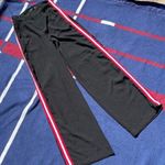 Romeo + Juliet Couture Romeo and Juliet Black dress pants with Red and white stripes at the side Photo 0