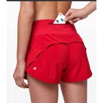 Lululemon Speed Up Short with a 4" inseam in Flamenco Red Swift Photo 9