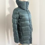 Uniqlo Women’s Ultra light down turquoise/emerald puffer jacket size small Photo 1
