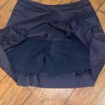Nike  Dri-Fit black golf skirt skort mini skirt woman’s size large Photo 1