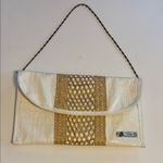 ELSIE…MADE IN THE BAHAMAS WHITE FAUX SKIN CLUTCH WITH STRAW DESIGN SNAP CLOSURE Photo 0