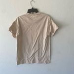 Ariana Grande  tan beige tee graphic tee t-shirt top short sleeve Photo 3