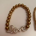 Set of 2 gold bead love bracelets Photo 1