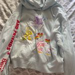 Sanrio  Light Blue Hoodie with Colorful Heart Design Photo 2