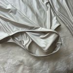 Babaton Elegant Cream Long Sleeve Bodysuit Photo 1