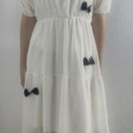 white dress with black bows Photo 0