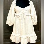 Mable  white Eyelet over the shoulder sleeve dress - Size Medium. *** Refer to measurements. Perfect Easter or spring dress... even graduation coming up.  Says Medium but sleeves extends for a heavy bustted top frame. Gently warn and excellent condition. Measurements approximately 15” from armpit to armpit x 32” long. None smoking home. Priced to sell at as is condition. Don’t like my price make reasonable offer. Photo 0