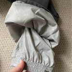 Helly Hansen  medium insulated dark grey snow pants. Adjustable waist and pockets Photo 11