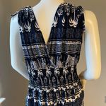New Women’s dark Navy Blue jumpsuit size L/XL for size 14 New with tags Straps are adjustable Stretchy with front pockets Photo 7