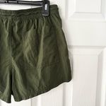 Athleta  Expedition Shorts Green Black Side Stripe Nylon Baggy Shorts 4 Photo 7