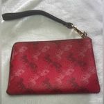 Coach  Corner Zip Wristlet in the color 1941 Red with Horse and Carriage print. Photo 1