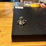 Beautiful ring it has a red colored heart stone in the middle. Size 6 angel. Photo 1