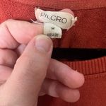 Anthropologie Pilcro by  Woman Size Medium twist-front sweatshirt in rust orange Photo 1