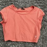 Gymshark coral cropped baby tee size small Photo 0