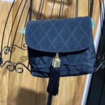 Neiman Marcus  Gold Tassel Bag Small
Luxury purse​​ Photo 1