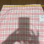 O'Neill Chic mini skirt with pink and white plaid pattern. Perfect for casual outings. Photo 1