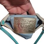 Coach  Poppy Woodmark Multicolor Text Wristlet with Teal Accents. Photo 5
