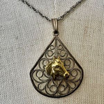 silver and gold tone horse teardrop pendant necklace Photo 0