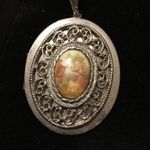 Silver tone vintage figural locket Photo 0