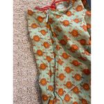 Boutique  Boho Green & Orange Floral V-Neck Racerback Jumpsuit Photo 4