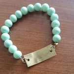 *5/$25 sale* XO goldtone plate & mint beaded stretchy bracelet Green Photo 2