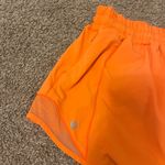 Lululemon Hotty Hot Low Rise Lined Shorts 4 Inch, Size 6 in “Highlight Orange” Photo 5