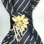 “Dainty Dapper” black Striped Tie Necklace with gold floral brooch Photo 3