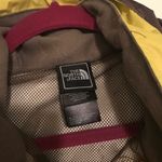 The North Face  lime green rain jacket Photo 2