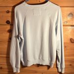 American Eagle Women’s long sleeve blue, yellow, and pink Photo 1