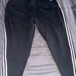 Adidas  Women's Black Joggers with White Stripes Photo 0