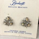 Vintage clip Brookcraft earrings new on card. Silver Photo 0