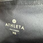 Athleta size XS dark blue 3/4 length leggings with geometric pattern down legs Photo 3