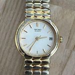 Seiko  Ladies Watch Gold Tone Stretch Bracelet Round White Dial Date Window Photo 1
