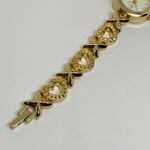 Women’s quartz analog gold tone wrist watch 23mm case white dial 7” Photo 3