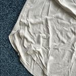 Lululemon size 8 Beige Long Sleeve Women's Top rounded bottom side slits Photo 2