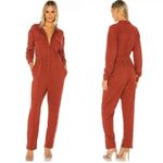 Free People rust colored eyelet jumpsuit zip up size 4β Photo 1