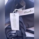 black Brazilian bikini swimsuit L laid out textured surface, likely a towel. Size L Photo 5