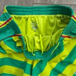 Nike  Dri-Fit Athletic Shorts Women's size Small in Green Yellow stripes running Photo 3