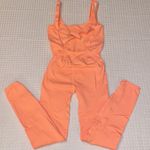 Free People NEW! $98  Movement Good Karma Onesie Neon Peach Coral XS/S Photo 0