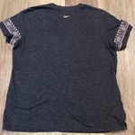 Nike women’s black/white Dri-Fit shirt with logo on sleeves size L Photo 5